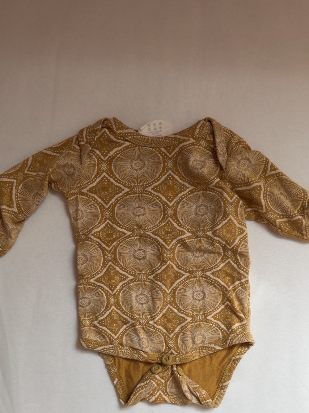 kate quinn Mustard and White Geometric Long-Sleeve Baby One-Piece